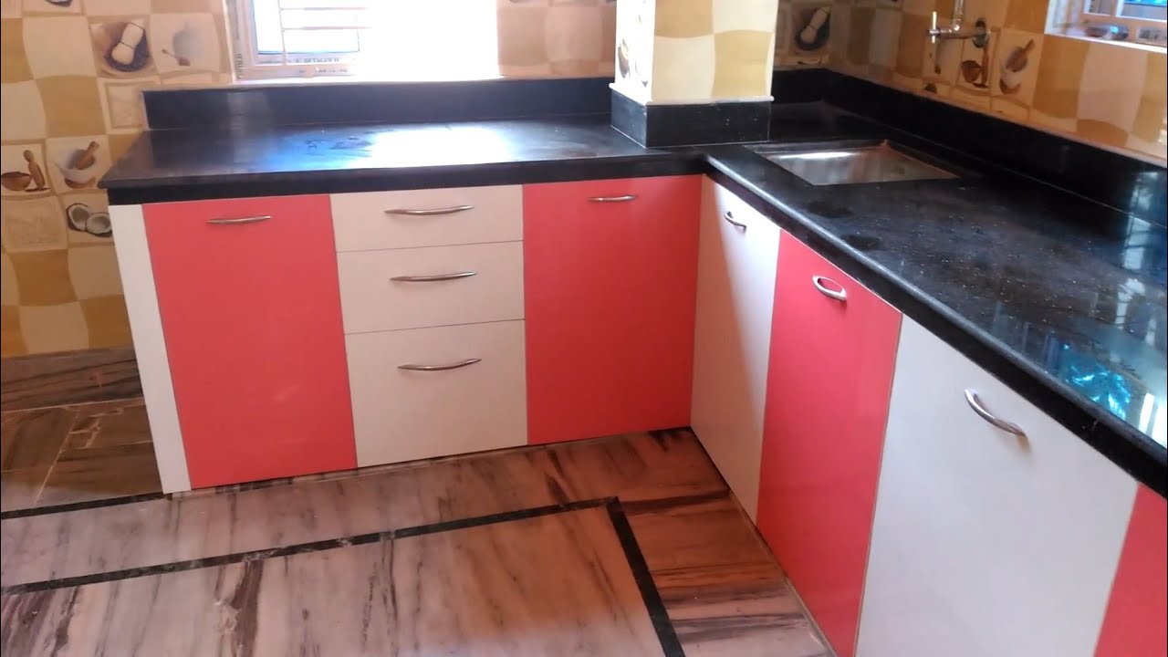 pink and white color modular kitchen